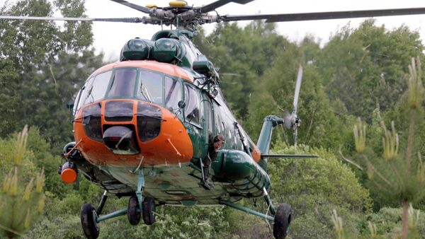 Вертолет Национальных вооруженных сил Латвии участвует в тушении пожара под Талси - Sputnik Latvija